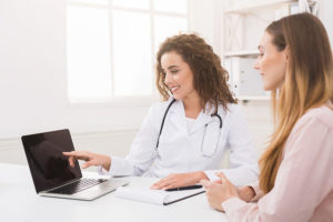 Female doctor and female patient review a nurse Consultation