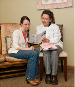 Heart to Heart nurse going over information with a female client